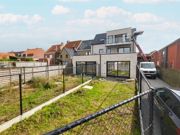 Gelijkvloers tweeslaapkamerappartement met zongerichte tuin